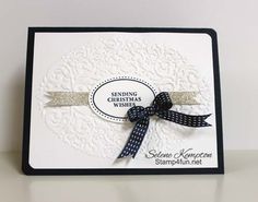 a close up of a card with a ribbon on the front and back of it