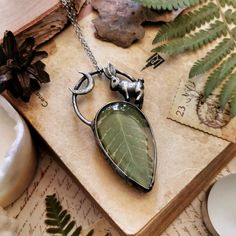 ♠ Real fern necklace with a wild hare and a crescent moon by Ragana The Wicth ♠ - This cottagecore pendant is made of Tin, copper and glass. - Dimensions: 7 cm long and 3.5 cm wide (2.8 inch long and 1.4 inch wide). - The pendant is covered with dark patina, which gives it some old-silver look. - Pendant goes with a chain. It's 50 cm long, but I can customize it to your needs. Just leave a note in the 'message to seller' box at a checkout. - Each piece of my jewelry is made in my home studio.. - Forest Witch Jewelry, Handmade Moon Shaped Nature-inspired Necklace, Nature-inspired Moon Charm Pendant Necklace, Nature-inspired Necklace With Moon Charm Round Pendant, Nature-inspired Necklace With Round Moon Charm Pendant, Nature-inspired Round Pendant Necklace With Moon Charm, Flower Forest, Copper Electroforming, Fern Necklace