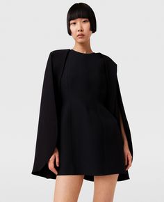 Women Pitch black Round Neck Cape Mini Dress | Stella McCartney US Black Elastane Dresses For Work, Black Elastane Dress For Work, Black Elastane Workwear Dresses, Black A-line Midi Dress In Elastane, Black Elastane Mini Dress For Formal Occasions, Black Structured Dress For Fall, Black Structured Fall Dress, Structured Long Sleeve Evening Dress, Formal Black Elastane Mini Dress