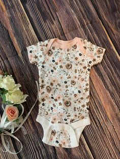 Tiny comfortable baby bodysuit for PreemieFloral designOnly 1 available Cute Floral Print Bodysuit For Spring, White Floral Print Onesie For Spring, Fitted Floral Print Onesie For Summer, Pink Fitted Printed Onesie, Spring Cotton Bodysuit With Floral Print, Pink Cotton Onesie With Floral Print, Pink Floral Cotton Onesie, Spring Floral Print Cotton Bodysuit, Pink Floral Print Cotton Onesie