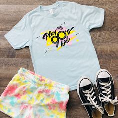 Play like a 90's kid - you know, more outside time and less screen time!  This shirt has a nostalgic 90's vibe.  Made from 100% ring-spun combed cotton, this classic youth jersey t-shirt is soft and comfy--great for an everyday outfit. If you want the family to match, you can find other sizes here! Toddler: https://www.etsy.com/QuietBookQueen/listing/1325308655/play-like-a-90s-kid-toddler-t-shirt Adult: https://www.etsy.com/QuietBookQUeen/listing/1325308987/play-like-a-90s-kid-adult-unisex-t-shirt * 100% ring-spun combed cotton * Soft jersey fabric * Fabric weight: 4.5 4.5 oz./sq. yd. (153 g/m²) * Crew neck and ribbed collar * Shoulder-to-shoulder taping * Double-needle stitched sleeves and bottom hem * Set-in sleeves * Blank product sourced from India, Mexico, Haiti, or Guatemala This pro 90s Inspired Blue T-shirt With Letter Print, 90s Inspired Blue Cotton T-shirt, Blue Pop Culture T-shirt For Summer, 90s Inspired Summer T-shirt With Funny Print, Unisex Pre-shrunk 90s Style T-shirt, 90s Inspired Multicolor Cotton T-shirt, 90s Inspired T-shirt For Summer Fan Merchandise, 90s Inspired Fan Merchandise T-shirt For Summer, 90s Style Summer T-shirt With Sublimation Print