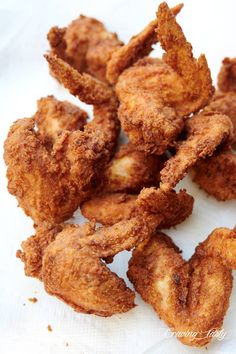 some fried food sitting on top of a white napkin