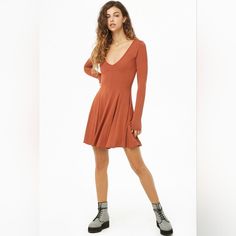 Forever 21 - Women's Long Sleeve V-Neck Skater Dress Size S Long Sleeve V-Neck Skater Dress. Beautiful Rust Color, And Very Flattering Fit With That Ideal Twirly Skirt. Size: S Color: Rust Shoulder 13.2" Chest 14.5" Waist 13" Length Sleeves: 25" Length 32" Sizing: Women’s Material: 100% Cotton, 20% Recycled Cotton Garment Length: Mini Style: Casual Type: Bodycon Neckline: V-Neck Sleeve Length: Long Sleeve Waist Line: Natural Fit Type: Slim Fit Fabric: High Stretch Twirly Skirt, Rust Color, Mini Fashion, Dress Beautiful, Skater Dress, Recycled Cotton, Women Long Sleeve, Style Casual, Length Sleeve