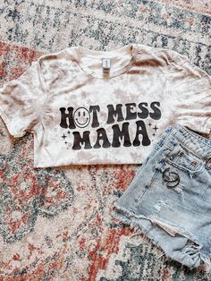 Hot mess Mama💕  Short sleeve -Softstyle Tshirt. Available sizes: S-XL For size reference, photo above it a size small.  PLEASE KEEP IN MIND - No two shirts will come out the exact same. The design pattern will be the same, but the exact placements of the bleached areas, also the intensity of the colors, will all vary shirt to shirt Cute Tie Dye Graphic Print T-shirt, Cute Tie Dye Graphic T-shirt, Cute Tie-dye T-shirt With Graphic Print, Cute Tie-dye Graphic Print T-shirt, Cute Tie Dye Tops With Letter Print, Cotton Tie-dye T-shirt With Letter Print, Funny Print Tie Dye Cotton Tops, Fun Tie Dye Tops With Letter Print, Cotton Tie Dye Tops With Funny Print