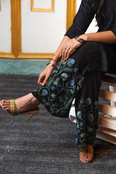 When aiming for an effortlessly chic look, nothing beats a pair of elegant, flowing pants. These Sharara pants are your go-to for evenings when a dress feels too formal and jeans too casual. The luxurious fabric drapes beautifully, creating a sensuous and polished silhouette. Custom embroidery adds a touch of detail and flair, making these pants a standout piece. Say goodbye to outfit dilemmas -- these pants do all the work, ensuring you feel both stylish and relaxed. Product Details - Condition Fitted Bottoms With Resham Embroidery For Wedding, Spring Embroidered Ankle-length Bottoms, Fitted Bollywood Pants With Zari Work, Fitted Embroidered Bottoms For Wedding, Traditional Bottoms With Dabka Work For Designer Wear, Traditional Designer Bottoms With Dabka Work, Unstitched Bottoms With Zari Work For Wedding, Bollywood Style Fitted Pants With Dabka Work, Formal Unstitched Sharara With Floral Embroidery