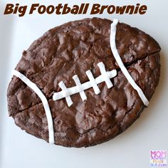 a chocolate cookie with white icing and a football on top that says, big football brownie