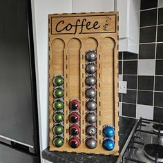 a kitchen counter top with magnets on it and a coffee cup holder in the middle