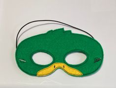 "Mallard Duck Masks. Great for dramatic play/dress-up. Fun mask for Halloween or Cos Play. These masks would make a fun party favor or fun addition to a themed birthday party. Need a larger quantity than what I have listed? Message me. I can usually accommodate larger orders. These masks are made from felt. The details are machine embroidered. The masks include a 13\" elastic strap. This size typically fits from age 3 to small adult. This mask measures approximately 7 by 4 inches. These items ca Green Halloween Costume Party Mask, Superhero Masks For Halloween Masquerade, Green Masks For Carnival Costume Party, Superhero Masks And Prosthetics For Halloween Costume Party, Green Masks And Prosthetics For Carnival Costume Party, Superhero Style Masquerade Masks For Halloween, Themed Green Costume For Costume Party, Green Masks And Prosthetics For Halloween Costume Party, Themed Green Halloween Costume