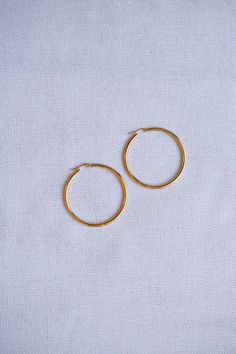 Classic Large Latch Back Gold Hoop Earrings, Classic Hoop Earrings, Classic Gold Hoops, Large Hoop Earrings, 80s Earrings, 80s Gold Hoops, Gold Latch Back Hoop Earrings, Gold Latch Back Hoops, Minimalist Gold Hoops, Minimalist Hoop Earrings, Minimalist Earrings ◊ Finish Options and Materials: Gold Plated over Stainless Steel ◊ Measurements: 1.875 in diameter, 3 mm thick ◊ Small hoop also available. See our other listing https://www.etsy.com/listing/689598709 ◊ Items typically ready to ship in 1- Small Hoop Retro Earrings For Pierced Ears, Small Retro Hoop Earrings, Small Retro Hoop Earrings As Gift, Retro Small Hoop Earrings As Gift, Retro Small Hoop Earrings Gift, 80s Earrings, Earrings Classic, Hoops Gold, Hoop Earrings Gold