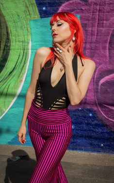 The Pink & Black Stripe Big Bells are your go-to stylish everyday pant. Dress these flattering pants up or down- truly perfect for almost any occasion. Design Features: High waistband hits comfortably at your true waist Waistband can be rolled down to expose belly Perfectly hugs hips Pant leg flares into large bells Fantastic garment to dress up and down. Incredibly vibrant print. Made in San Francisco, CA, USA Fabric Features: Radical vertical Pink and Black stripe. Moisture Wik Polyester/Spand Black 4-way Stretch Bottoms For Night Out, Summer Workout Stretch Pants, Bold High Waist Stretch Bottoms, Black Elastane Yoga Pants For Spring, Black Pants With Wide Waistband For Spring, Black Yoga Pants For Summer, Black 4-way Stretch Bottoms For Spring, Spring High Waist Black Yoga Pants, Trendy Black Yoga Pants For Spring