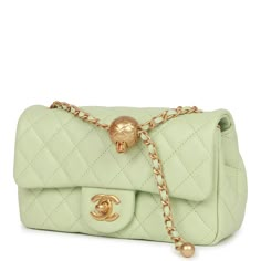 This Pearl Crush Mini Rectangular flap bag is of green lambskin with antique gold tone hardware and has a front flap with signature CC turnlock closure, rear half moon pocket, single interwoven green leather and antique gold tone chain link shoulder/crossbody strap with adjustable "pearl" ball. The interior is lined in green leather and features a zipper pocket with Chanel pull and an open pocket below. Collection: 22C Origin: Italy Condition: Pristine; new or never Accompanied by: Chanel box, C Chanel Pearl Crush, Vintage Chanel Bag, Chanel Pearl, Chanel Box, Chanel Pearls, Bag Green, Sierra Leone, Green Bag, Green Leather