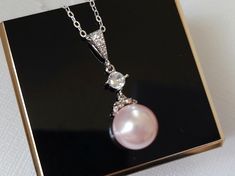 Wedding Light Pink Rosaline Blush Pink Pearl Drop Silver Bridal Pendant Necklace with .925 Sterling Silver Chain. CHAIN is 18 inches (45.7cm) long. PENDANT is about 1.13 inch (2.9cm) long including bail. MATCHING EARRINGS Pic.#7: https://www.etsy.com/listing/618167974/pink-pearl-earrings-blush-pink-pearl?ref=shop_home_active_19 BRIDAL NECKLACES SECTION: https://www.etsy.com/shop/LanaChayka?ref=seller-platform-mcnav§ion_id=11638944 BRIDAL JEWELRY SETS SECTION: https://www.etsy.com/shop/LanaChayka Elegant Pink Pearl Necklace For Anniversary, Elegant Blush Necklace For Gift, Elegant Pink Bridal Necklace For Wedding, Pink Elegant Bridal Necklace, Delicate Pink Pearl Necklace For Wedding, Pink Pearl Pendant Jewelry For Anniversary, Pink Round Jewelry For Wedding, Round Pink Bridal Necklace For Wedding, Pink Pearl Pendant Jewelry For Wedding