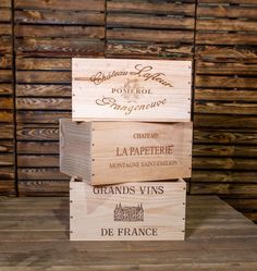 three wooden boxes stacked on top of each other with the words la papeerie