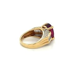 GIA Certified Oval Brilliant 7 Carat Purplish Red Tourmaline Ring, set in 18K Two Tone Gold. Adorned with 26 Round Cut Diamond Side Stones, Totaling 1.35 carats.  The center stone has a rich deep color saturation and minimal/none inclusions to the naked eye. Set in a 4-prong 18k solid gold mounting with a wide frame that contrasts the long oval cut dimensions of the center stone. `  GIA Item Description: Center stone set in yellow and white metal ring with numerous near-colorless round brilliant Formal Oval Ruby Ring With Center Stone, Luxury Oval Ruby Ring With Accent Stones, Formal Oval Ruby Ring With Prong Setting, Oval Multi-stone Ruby Ring, Formal Ruby Gemstones With Accent Stones, Formal Ruby Ring With Oval Cabochon Center Stone, Formal Ruby Ring With Oval Cabochon, Oval Multi-stone Ruby Ring In Yellow Gold, Oval Multi-stone Ruby Ring For Formal Occasions