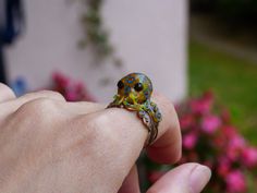 Ever since i made my original octopus ring, I've been asked to do a Blue Ringed Octopus. Here it is! Little octopus is completely handcrafted and hand painted by me from polymer clay. She is just like a real one, minus deadly!  Look at the animals from this collection as familiars, spirits that keep you company, or personal talisman. Each one is made especially for you, unique in some way as I make each without a mold. Animals are special kind of inspiration for me, so I created my animals ring Blue Ringed Octopus, Ringed Octopus, Tentacles Ring, Octopus Jewelry, Octopus Ring, Paper Ring, Nautical Jewelry, Animal Rings, Lovers Gift