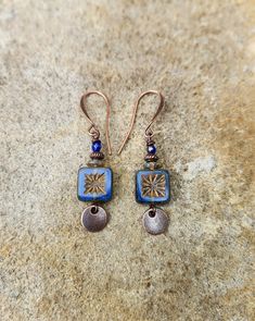 "tiny blue earrings   czech glass earrings   small boho dangle earrings * small Czech glass oval beads - cloudy light blue with dark brown coating on edges - 9x10mm * tiny dark brown glass bead on top * antiqued brass small hook ear wires * length from top of ear wires - 1\" * you can enter my shop here:    gypsydangles.etsy.com" Bohemian Blue Hypoallergenic Jewelry, Bohemian Blue Earrings, Blue Hypoallergenic Copper Earrings, Blue Copper Pierced Earrings, Blue Pierced Copper Earrings, Blue Czech Glass Dangle Jewelry, Nickel-free Blue Copper Jewelry, Blue Earrings With Colorful Czech Glass Beads, Artistic Blue Czech Glass Jewelry