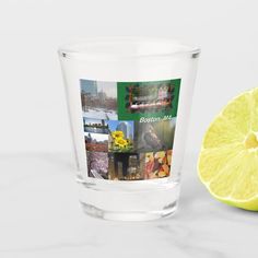 a shot glass filled with different pictures and a lemon