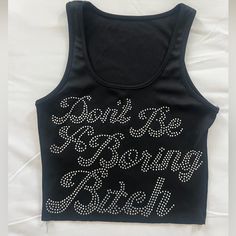 Y2k Bedazzled Tank Top- “Dont Be A Boring B*Tch” Never Worn! Cropped Length. Super Cute #Y2k #Y2ktanktop Y2k Tops With Letter Print For Night Out, Y2k Letter Print Tops For Night Out, Y2k Style Tops With Letter Print For Night Out, Y2k Stretch Tops With Rhinestones, Y2k Party Tops With Rhinestones, Trendy Rhinestone Tops For Club, Y2k Summer Tops With Rhinestones, Summer Y2k Tops With Rhinestones, Fitted Black Tank Top With Rhinestones