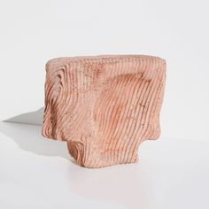 a pink sculpture sitting on top of a white table