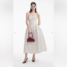 New With Tag For Partygoers After A Hearty Dose Of Vintage Chic, This Polka Dot Taffeta Dress Falls From A Timeless Bandeau Neckline To A Flattering Dropped Waist And Full Photo-Ready Midi Skirt. Fitted Style, Take One Size Up If Between Sizes This Style Has Minimal Stretch Zip Closure At Back Removable Shoulder Straps Hidden Pockets At Side Model Is 5ft10/178cm And Wears A Size Uk 8 Chic Evening Dresses In Polka Dot, Chic Polka Dot Evening Dress, Elegant Polka Dot Midi Dress For Evening, Silk Polka Dot Spring Dress, Silk Polka Dot Dress For Spring, Spring Silk Polka Dot Dress, Polka Dot Midi-length Evening Dress, Polka Dot Midi Evening Dress, Polka Dot Midi Length Evening Dress