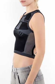 This cool cropped tank is crafted in a close-fitting silhouette with a tied-and-cutout back. 15" length (size Medium) Ties at back Crewneck Sleeveless 38% polyester, 35% recycled polyamide, 21% polyamide, 6% elastane Machine wash, line dry Made in Turkey Fitted Racerback Crop Top With Built-in Bra, Black Tank Crop Top With Built-in Bra, Fitted Black Tank Crop Top, Black Fitted Tank Crop Top, Summer Cropped Black Sports Bra, Black Cropped Sports Bra For Summer, Cropped Black Sports Bra For Summer, Sleeveless Seamless Crop Top For Gym, Black Bra Friendly Crop Top