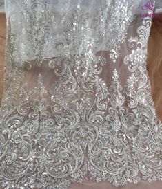 Price: The price is for 1 yard. if you buy more than 1 yard ,it won't be cut. will come in one piece the longest is 20 yards. Material: polyester,pearls,sequins,beads Fixed Wide : 125cm or 49 inches. color:off white,silver Want to see other colors and more similar Beading lace fabrics come to: https://www.etsy.com/shop/Randyfabrics?ref=hdr_shop_menu&section_id=14192305 Shipping: Choose the shipping way you need, if you want package shipped by express,please note the phone number on order. Us Silver Embroidered Fitted Fabric For Wedding, Fitted Silver Embroidered Fabric For Wedding, Silver Lace Embroidered Fabric For Wedding, Elegant Silver Embroidered Fabric With Lace Work, Fitted Silver Lace For Party, Elegant Silver Lace With Sequins, Elegant Silver Lace With Intricate Embroidery, Silver Lace Tulle Fabric For Wedding, Silver Lace With Lace Work For Party