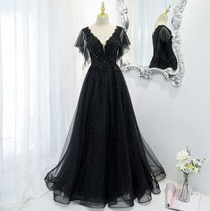 V-neck Evening Gown For Banquet, Black V-neck Gown For Banquet, Black A-line Tulle Evening Dress, Evening V-neck Gown For Party Season, V-neck Maxi Dress For Banquet And Party Season, A-line Tulle Ball Gown For Party, V-neck Wedding Gown For Party Season, V-neck Evening Gown For Prom Season, A-line Tulle Gown For Party