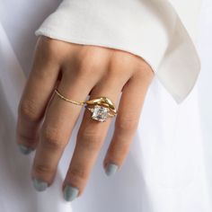 a woman's hand with a ring on it