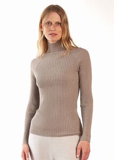 No need to sacrifice fashion for comfort—this cozy mock neck sweater offers the best of both. Layered or on its own, this top offers comfy sophistication après-ski or dressed up with our long ribbed skirt. Plus, you'll love the incredibly soft feel against your skin. Details Light transitional weather weight Fitted mock neck hits below chin Variegated rib body and sleeves Model is a size 4 and wears a size small 23.5" body length and fitted through body 72% viscose/28% PBT Machine wash delicate/ Ribbed Skirt, Rib Top, Womens Turtleneck, Mock Neck Top, Ribbed Top, Mock Neck Sweater, Softest Sweater, Body Fit, Slow Fashion