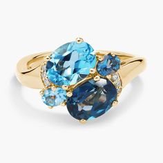 Expertly crafted from luxurious 14k yellow gold, this ring features an exquisite  London Blue Topaz gemstone as well as a mesmerizing Swiss Blue Topaz gemstone. To add even more opulence, this ring also features delicate diamond accents that wrap around, glistening in the light with every movement Luxury Yellow Gold Topaz Birthstone Ring, Elegant Multi-stone Topaz Ring In 14k Gold, Fine Jewelry Multi-stone Blue Topaz Ring, Elegant Sapphire Multi-stone Topaz Ring, Fine Jewelry Yellow Gold Multi-stone Topaz Ring, Luxury Multi-stone Topaz Ring In 14k Gold, Luxury Blue Multi-stone Topaz Ring, Blue Multi-stone Topaz Ring, Fine Jewelry Blue Topaz Gemstones