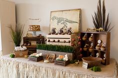 a table topped with lots of different types of plants and food on top of it