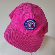 Electric pink corduroy hat with a patch on the front advertising Mammoth Mountain in California. The underside of the brim is a green and the hat has a pink adjustable back. Brand: No tag. Material: 100% Cotton Size: One Size with adjustable back. Adult size. Condition: Excellent vintage condition! Casual Pink Hats With Logo Patch, Retro Pink Cotton Hat, Pink Adjustable Flat Cap, Adjustable Pink Flat Cap, Retro Pink Hat For Streetwear, Pink One Size Fits Most Flat Cap, Pink Vintage Adjustable Baseball Cap, Vintage Pink Flat Brim Hat, Pink Flat Brim Hat For Outdoor