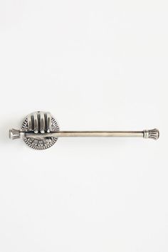 an old fashioned metal handle on a white wall