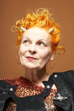 a woman with red hair and horns on her head