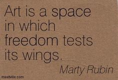 a piece of cardboard with the words art is a space in which freedom tests its wings