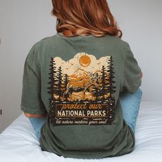 ✺ PROTECT OUR NATIONAL PARKS - GRANOLA GIRL GRAPHIC SHIRT  ✺ Get this trendy Comfort Colors graphic tee. * Q U I C K F A C T S * This design is a unique, one-of-a-kind awesome illustration that has been created in house. ✺ 100% ring-spun cotton ✺ Medium fabric ✺ Relaxed fit Please note that colours may appear different on different digital screens and may not be a true representation of the actual colours. This is a Unisex T-Shirt which you can use as an Oversize T-Shirt Dress, please check the Granola Style, Earth Day Shirt, Thrift Store Outfits, Granola Girl Aesthetic, National Park Shirt, Merch Design, Wardrobe Makeover, Oversized T Shirt Dress, Clothing Shopping