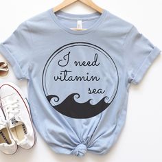 I Need Vitamin Sea is the perfect beach vacation shirt. This beachy t-shirt is everything you've dreamed of and more. It feels soft and lightweight, with the right amount of stretch. It's comfortable and flattering for all.  Show off your personality with our fun and unique designs!   ** P R O D U C T   D E T A I L S **  - High Quality, Super Soft and Comfy Bella + Canvas T-Shirt  - 100 % Pre-Shrunk Cotton  (heather colors are polycotton blend)  - Direct to Garment print (no stencils or vinyl wh Trendy Beach Vacation Shirt, Vsco Style Beach Tops For Vacation, Funny Print Beach Shirt For Spring, Spring Beach Shirt With Funny Print, Funny Print T-shirt For Beach Vacation, Trendy Vacation Shirt With Letter Print, Summer Shirt For Beach Party Vacation, Beachy Shirt For Beach Party, Beachy Vacation Shirt