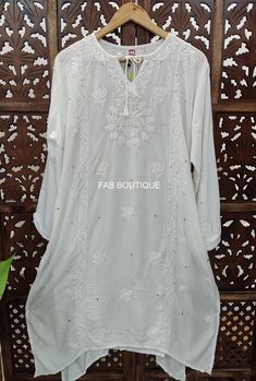 Description ▪ Fabric: Muslin ▪ Sleeves: 3/4 Sleeves ▪ Style: Straight Kurti ▪ Kurti Length: 44-46 Inches ▪ Occasions: Party Wear, Office Wear, Festive Wear ▪ Garment Care: Hand Wash Only ▪ Package Contains: 1x Kurti Disclaimer : Color may be little vary due to lighting effect. White Long Sleeve Blouse With Chikankari Embroidery, White Bollywood Style Long Sleeve Kaftan, Traditional Long Sleeve Blouse With Dabka, Traditional Long Sleeve Dabka Blouse, White Bollywood Long Sleeve Kaftan, White Long Sleeve Bollywood Kaftan, Traditional Tunic For Diwali, Traditional Eid Kurta With 3/4 Sleeves, Traditional 3/4 Sleeve Kurta For Eid