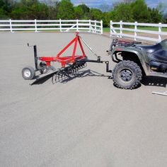 an atv pulling a trailer behind it