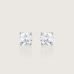 Our Martina earrings are a pair of glamorous 1.04ct diamond earrings. There's nothing more classic to wear than our Martina diamond earrings. They are iconic, classic and beautiful. With their perfect cut and impeccable shape, they are every woman's must-haves. A 5mm White diamond held by 4 white gold prongs and closes with a butterfly back. The earrings are sold as singles The Martina can be worn to top off an exquisite evening look. They are both classic and stunning, and add the perfect sparkle for a polished, feminine style. They can be customized with any stones of your choice. All features can be customized! please contact us if you wish to make changes, we love making custom designs. All of our jewelry is carefully handmade in our atelier *HC diamond are all conflict-free diamonds T Timeless White Earrings With Diamond Accents, Elegant Everyday Luxury Brilliant Cut Diamond Earrings, Timeless Round Diamond Earrings For Formal Occasions, Timeless Diamond Cut Earrings For Formal Occasions, Timeless Cubic Zirconia Diamond Earrings With Prong Setting, Timeless Brilliant Cut Earrings For Formal Occasions, Classic Brilliant Cut Earrings For Formal Occasions, Classic Platinum Earrings For Formal Occasions, Timeless White Platinum Earrings