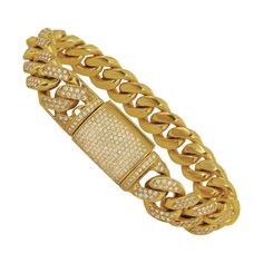 CUSTOM MADE DIAMOND MIAMI CUBAN LINK SOLID BRACELET IN 10K GOLD. -10k yellow gold -Length: 8.5” -Width: 0.55” -Weight: 114.5 gr -Diamond: 12.90 ct, VS clarity, G color Retail: $15,000 Miami Cuban Link, Mens Gold Bracelets, Miami Cuban, Gold Bracelets, Mens Gold, Cuban Link, 10k Gold, Custom Made, Gold Bracelet