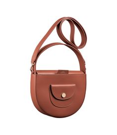 A.P.C. Women's bag. - Smooth, vegetable-tanned leather. - Adjustable shoulder strap to carry bag on shoulder. - Interior flap with magnetic closure. - Interior pocket. - Exterior pocket with goldtone snap engraved A.P.C. - Pale-colored topstitching. - Embossed goldtone 'A.P.C. Rue Madame Paris' logo. Everyday Cognac Flap Bag With Detachable Strap, Cognac Crossbody Flap Bag With Detachable Handle, Cognac Saddle Bag With Adjustable Strap For Work, Cognac Crossbody Saddle Bag With Leather Handles, Cognac Saddle Bag With Detachable Strap For Daily Use, Cognac Saddle Shoulder Bag With Adjustable Strap, Brown Shoulder Bag With Adjustable Strap And Round Handle, Cognac Saddle Bag With Leather Handles, Workwear Saddle Bag With Detachable Handle