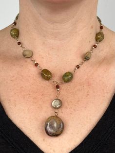 Handmade natural gemstone beaded necklace for person with a petite neck. This is an antiqued gold-tone single chain necklace comprised of polished light brown mother of pearl coin beads, faced brown plastic beads, natural polished green and brown agate gemstones. This beaded necklace has a pendant of a polished light brown mother of pearl coin beads and brown jasper gemstone, and is closed with a antiqued gold-tone toggle-clasp. This is a brown, mustard and hunter green handmade chunky necklace Handmade Stone Necklace, Green And Brown Outfit, Brown Necklaces, Boho Necklace Layering, Bohemian Beaded Jewelry, Brown Ocean, Etsy Necklace, Diy Wire Jewelry Rings, Earthy Necklace