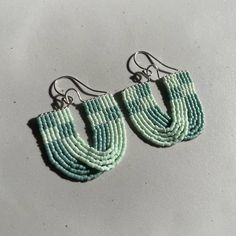 These fun, Mint and Seafoam checkered beaded earrings are hand threaded using 11/0 Miyuki Delica beads and Nymo thread. They are also made with sterling silver wire and earring hooks. These are about 6 cm long with the earring hooks and 3.5 cm wide. All orders include a polishing cloth and a muslin jewelry bag. Earrings are made to order so it can take up to a week or so to make and have shipped out to you. Thank you so much for your patience! All of my art and jewelry are made with so much love Unique Sterling Silver Beaded Earrings, Sterling Silver Earrings With Tiny Round Beads, Handmade Blue Heishi Beads Earrings, Artisan Green Beaded Earrings With Tiny Beads, Artisan Green Earrings With Tiny Beads, Adjustable Handwoven Green Beaded Earrings, Colorful Round Beaded Sterling Silver Earrings, Colorful Beaded Earrings In Sterling Silver, Colorful Sterling Silver Beaded Earrings