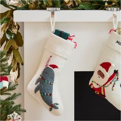 two christmas stockings hanging from the wall