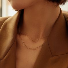 This modern necklace sets the stage for limitless glamour with its unique style. A sparkling round brilliant cut diamond is artistically placed in a paper clip halo pendant that is centered on a shiny rolo link chain. This design is a refreshing take on a timeless look with a contemporary edge that is perfect for day or night. Product Details: Material: 14K Solid Gold Chain Type: Cable Chain 0.9mm thickness Chain Length: 16 inches Extension Chain: 2 inches Pendant Dimension: 5.6mm*3.6mm Stone Ty Modern Diamond Necklace With Delicate Chain, Modern Diamond Chain Necklace Gift, Modern Diamond Chain Necklace As Gift, Modern Everyday Luxury Jewelry With Paperclip Chain, Modern Open Circle Necklace For Formal Occasions, Modern Diamond Necklace With Cable Chain, Minimalist Diamond Cable Chain Necklace, Elegant Sterling Silver Paperclip Chain Necklace, Elegant Paperclip Chain Necklaces