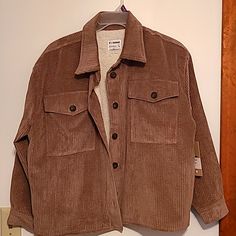 Nwot Cisono Taupe Color Corduroy Button Up Jacket With Sherpa Lining Sz L Button Front & Cuffs. Soft Taupe Corduroy With Sherpa Lining. Button Cuff Sleeves, 2 Front Glap Pockets. Has Extra Button. Great Look With Jeans Has Some Stretch. Pit To Pit 27 Inches Length 25 Inches 24/9 Corduroy Button Up, Long Sleeve Corduroy Shacket With Buttons, Corduroy Button-up Shacket With Buttons, Corduroy Button-up Shacket, Corduroy Collared Shacket With Buttons, Collared Corduroy Shacket With Buttons, Corduroy Outerwear With Button Closure And Long Sleeves, Corduroy Long Sleeve Outerwear With Buttons, Long Sleeve Corduroy Outerwear With Buttons