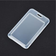 a clear plastic case on a black surface with a clipping for the back cover