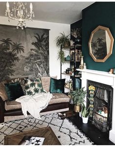 a living room filled with furniture and a fire place in front of a painting on the wall