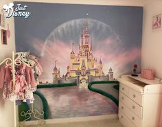 a child's bedroom with a castle mural on the wall